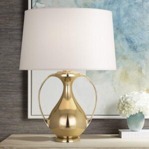 Blue table lamps — cobalt glass and brass lamp showing the dramatic shift between daytime saturated blue and nighttime illuminated amber-gold