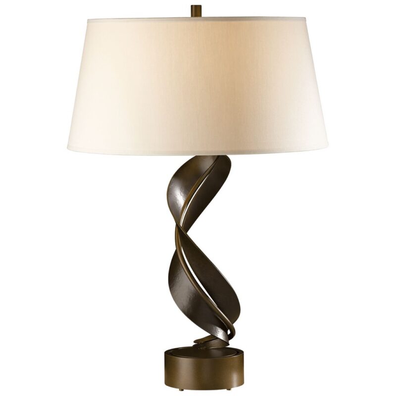 Luxury table lamps — Zeus gold leaf lamp showing material quality, proportional refinement, and surface finish of luxury table lamp design