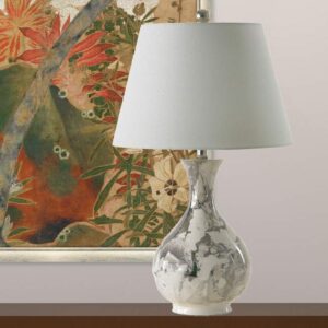 Table lamps for dining room — Zeus gold leaf lamp on a sideboard creating secondary warm ambient light beside a dining room chandelier