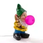 Primary / hero Gnome table lamp with gold shovel blowing a glowing pink bubble-gum LED bubble 78