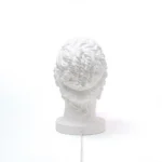 Profile view of the goddess bust lamp showing braided hair detail