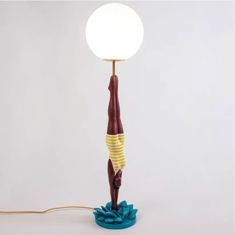 14937-diver-lamp-yellow-4_0082bdaf-82d9-4488-98bd-7a08f1a3709c Retro table lamp — yellow diver plunging from white glass globe, teal splash base