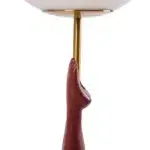 Close-up of yellow-striped diver figure and teal splash base on the retro lamp