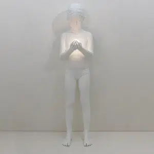 Figural floor lamp with reclining white resin figure
