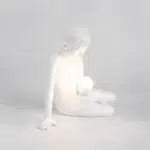 Close-up of the glowing G4 LED orb held against the boy figure's chest