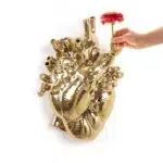 Full view of oversized gold heart vase scale