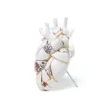 Side view of gold seam heart vase