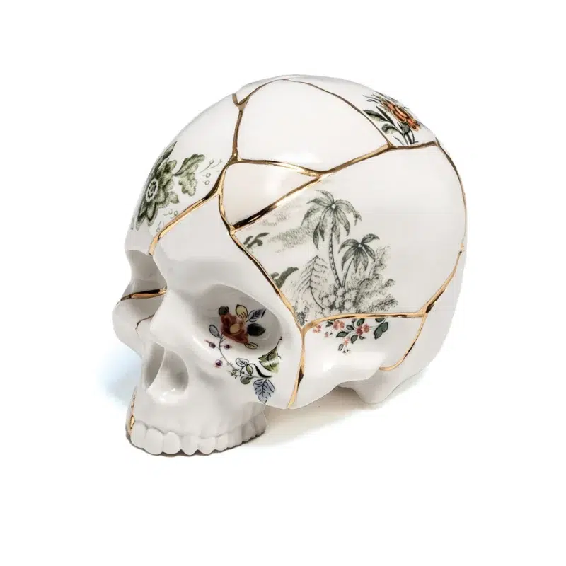Kintsugi skull sculpture with real 24k gold seams