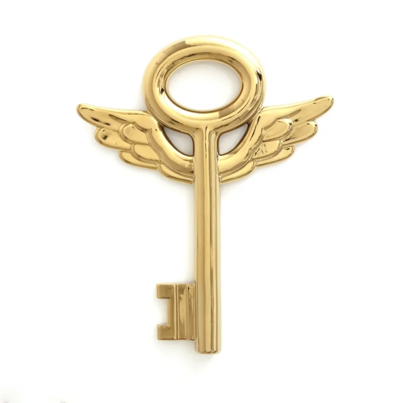 Gold key sculpture styled on a console table
