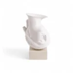 Floating head vase styled on a console table
