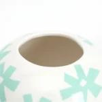 Porcelain lidded jar vase, tall sculpted-lid vessel
