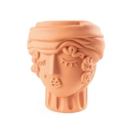 Close-up of the terracotta woman vase surface texture