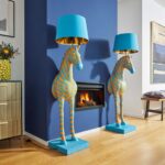 Floor Lamp Zebra Print Blue and Orange, shown illuminated in a living room setting