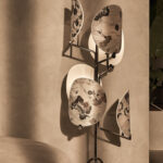 Multi light floor lamp illuminated, full height view