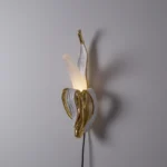 Wall Lamp Banana Gold, full front view of the banana sculpture