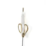 Wall Lamp Banana Gold, shown mounted in a living room
