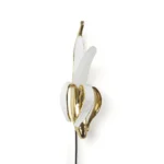 Wall Lamp Banana Gold, shown mounted in a living room