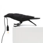 Wall Lamp Raven Black Playing Outdoor, full front view of the raven sculptur