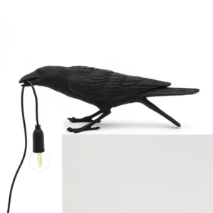 Wall Lamp Raven Black Playing Outdoor, full front view of the raven sculptur
