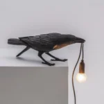 Wall Lamp Raven Black Playing Outdoor, close-up detail of the resin finish