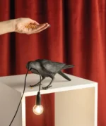 Table Lamp Raven Black Playing, shown on an entryway console