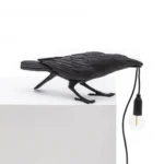 Table Lamp Raven Black Playing, shown on an entryway console