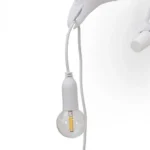 Table Lamp Raven White Looking Left, shown on an entryway console
