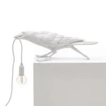 Table Lamp Raven White Playing, full front view of the raven sculpture