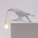 Table Lamp Raven White Playing, shown on an entryway console