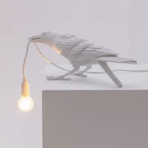 Table Lamp Raven White Playing, shown on an entryway console