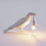 Table Lamp Raven White Waiting, shown on an entryway console