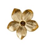 Wall Lamp Flower Gold, shown mounted in a bedroom setting