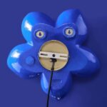 Wall Lamp Flower Blue, illuminated view showing the indirect glow