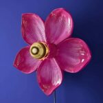 Wall Lamp Flower Magenta, shown mounted in a bedroom setting