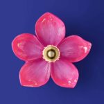Wall Lamp Flower Magenta, shown mounted in a bedroom setting