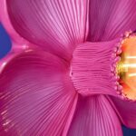 Wall Lamp Flower Magenta, shown mounted in a bedroom setting