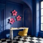 Wall Lamp Flower Magenta, shown mounted in a bedroom setting