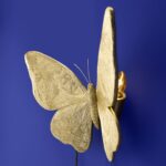 Wall Lamp Butterfly Gold, shown mounted in a living room