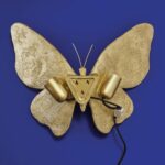 Wall Lamp Butterfly Gold, shown mounted in a living room