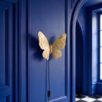 Wall Lamp Butterfly Gold, shown mounted in a living room