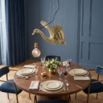Ceiling Lamp Duck Gold, shown mounted in a living room