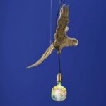 Ceiling Lamp Parrot Gold, shown mounted over a dining table