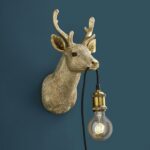 Wall Lamp Deer Gold, shown mounted in a nursery or hallway