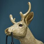 Wall Lamp Deer Gold, shown mounted in a nursery or hallway