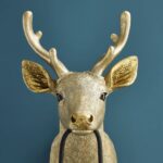 Wall Lamp Deer Gold, shown mounted in a nursery or hallway