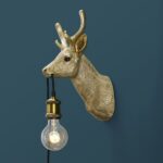 Wall Lamp Deer Gold, shown mounted in a nursery or hallway