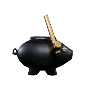 Black ceramic sculpture of a shattering piggy bank, front view