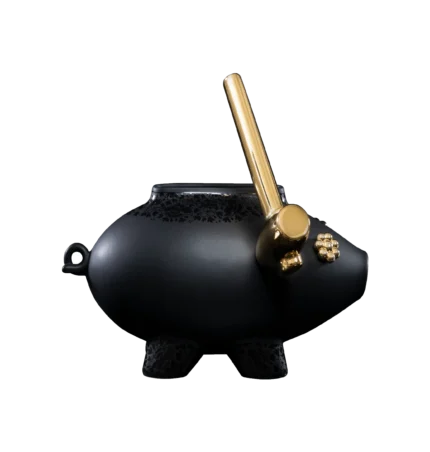 Black ceramic sculpture of a shattering piggy bank, front view