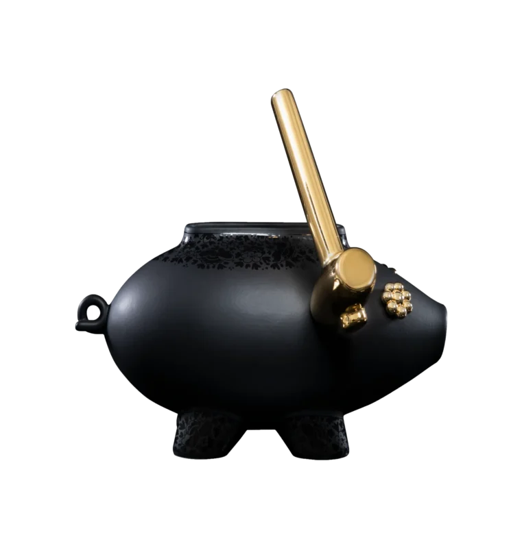 Black ceramic sculpture of a shattering piggy bank, front view