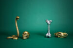 Close-up of gold human skull sculpture detail